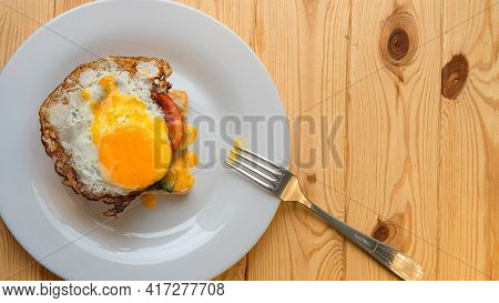 Homemade Sandwich With Fried Egg And Spread Yolk And Fork Top View Flat Lay Copy Space
