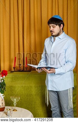 Before The Chuppah Ceremony, The Jewish Groom Reads Siddur Prayers In The Synagogue. Vertical Photo