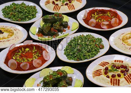 Lebanese Food Mezze, Includes Hummus, Muhammara, Moutabal, Taboule And Vine Leaves