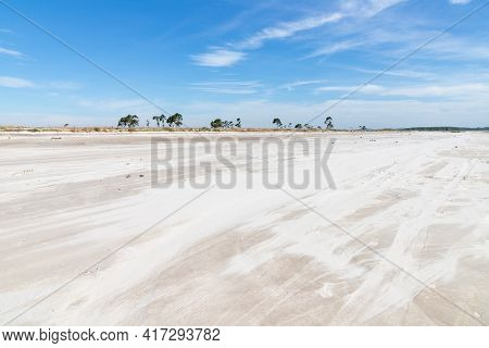Sand And Vegetation With Blue Sky In Lagoa Dos Barros Lake, Osorio, Rio Grande Do Sul, Brazil