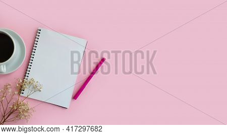 Notebook, Cup Of Coffee, Gypsophila Flower On Colored Background