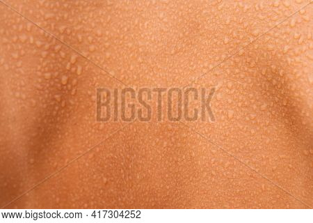 Close Up Of Water Or Sweat Drops On The Woman Back Skin. Human Wet Skin