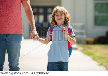 Kid Elementary Student Carrying Backpacks Holding Parent Fathers Hand Walking Up Educational Buildin