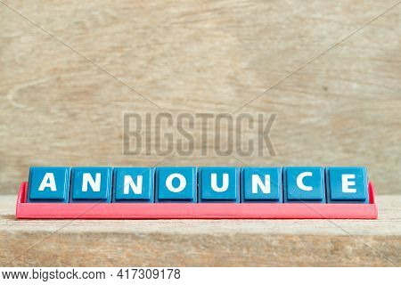 Tile Alphabet Letter With Word Announce In Red Color Rack On Wood Background
