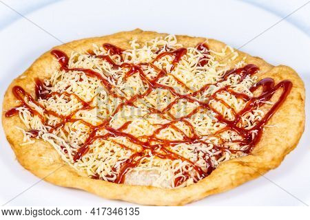 Langos Stuffed With Grated Cheese And Dressing.langos Is A Traditional Hungarian Food. Food Styling 