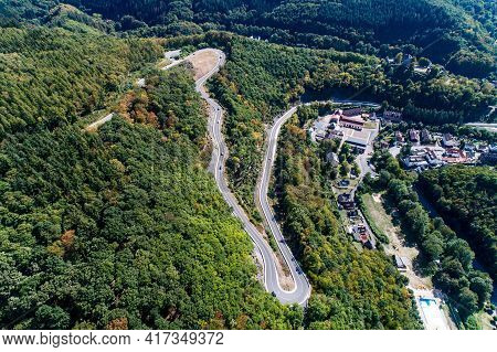 Winding Road Serpentine From A High Mountain Pass In The Rhine Village Bendorf Sayn Germany Aerial V