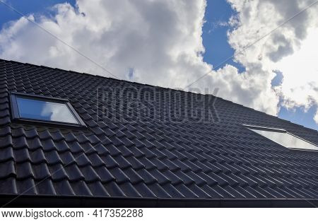 Roof Window In Velux Style With Black Roof Tiles