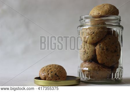 Home Baked Masala Cookies In A Glass Bottle. Masala Cookies Are Sweet And Are Also Spicy With Flavou