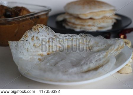 Hoppers And Rice Pancakes. Two Types Of Red Rice Breakfast Dishes Along With Chicken Curry Made With