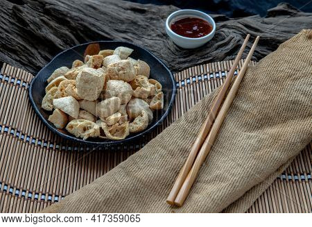 Deep Fried Crispy Tofu Or Fried Bean Curd Served With Sweet And Sour Spicy Sauce. Selective Focus.