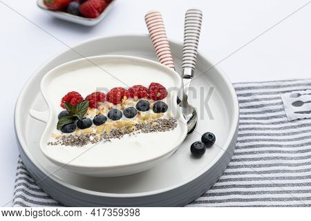 Fresh Yogurt With Fruits, Granola, Chia Seeds Und Napkin
