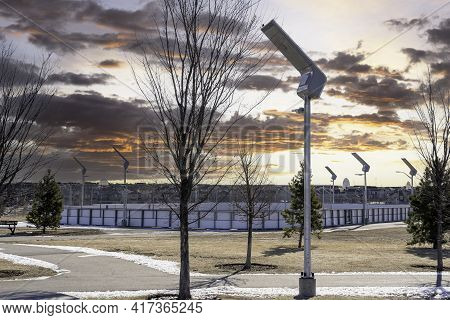 Solar Powered Street Lights At An Outdoor Recreation Park Recharging At Sunrise In Airdrie Alberta C