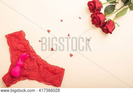 Womens Panties Hearts And Clitoral Vibrator And A Bouquet Of Roses. Gift Set For A Woman. Flat Lay