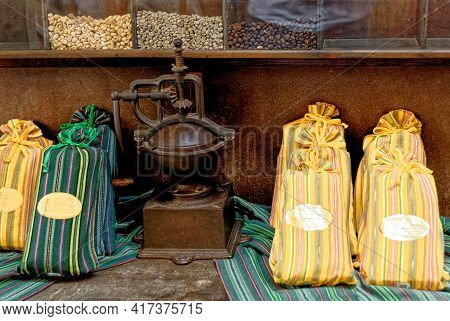 Shop Desplay With Old Coffee Grinder, Coffee Beans And Coffee Bags For Sale In Coffee Shop - Antigua