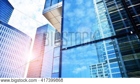 Downtown Corporate Business District Architecture. Glass Reflective Office Buildings Against Blue Sk