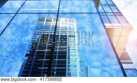 Downtown Corporate Business District Architecture. Glass Reflective Office Buildings Against Blue Sk