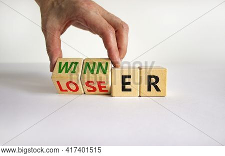 Loser Or Winner Symbol. Businessman Turns Cubes And Changes The Word 'loser' To 'winner'. Beautiful 