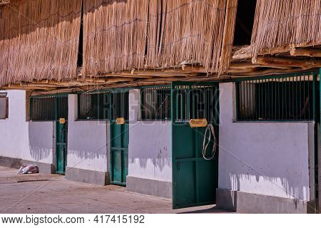 Stables In The Village. View Of The Stable, Attic With Hay For Horses