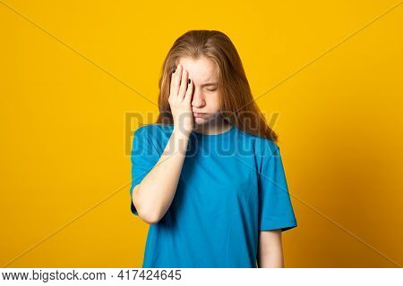 Exhausted Girl Covers Half Of Face, Sighs From Tiredness, Has Sleepy Expression, Closes Eyes, Wears 