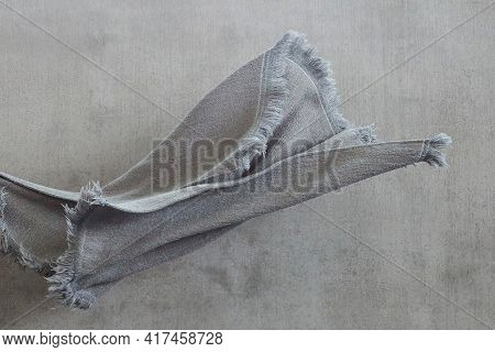 Flying Grey Blanket On Grey Background. Craft Rug For Cold Winter