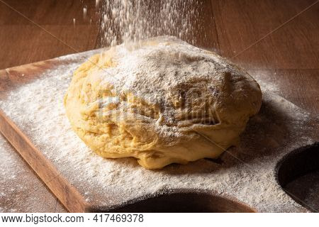 Dough Being Sprinkled With Wheat On Wood, Selective Focus.