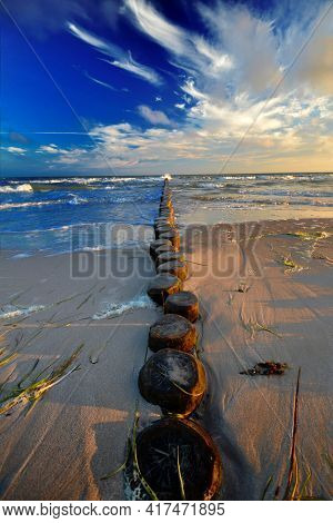 Gentle Baltic Sea At Groin Breakwater In The Morning Around Sunrise