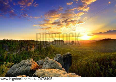Saxon Switzerland Elbsandstone Sunrise At National Park Rock Peak Above Forest