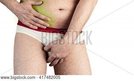A Man In Shorts Holding On To His Sore Side. Sick Liver. Sharp Pain In The Side. Isolated White Back