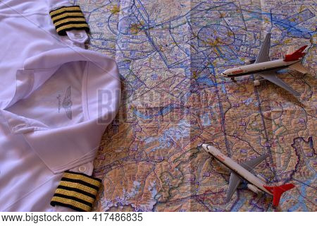 Aircraft Toys On An Air Navigation Map And Golden Captain Stripes 25.3.2021