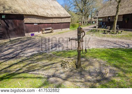 Orvelte, Netherlands - April 16, 2021: Historic Water Pump On The Central Square Of Orvelte, Netherl