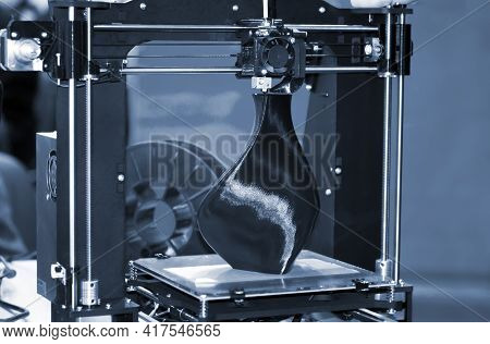 3d Printer Printing A Model In The Form Of Black Vase Close-up.