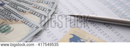 Bank Credit Card And Dollars Lying On Table With Numbers Closeup