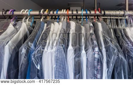 freshly washed shirts in a dry cleaner