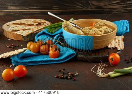 Soup With Matzo Dumplings And Chicken With Carrots And Tomatoes. Healthy Food For Passover