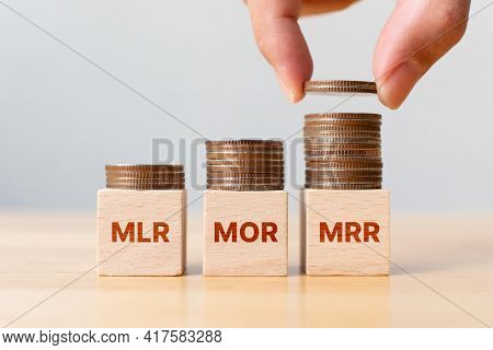 Interest Rate Mortgage Property Investment Mlr, Mor, Mrr. Coin Stack Step On Wooden Block