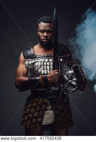 Studio Shot Of Fearful Authentic Gladiator Of African Descent With Gladius