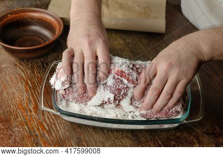 Homemade Capicola (coppa). Dry-cured Pork Loin Step-by-step Recipe. A Man Is Massaging A Large Piece