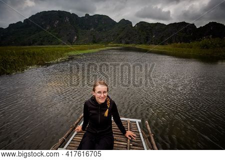 Beautiful Landscape With Young Happy Tourist In Van Long Nature Reserve, Tam Coc, Ninh Binh In Vietn