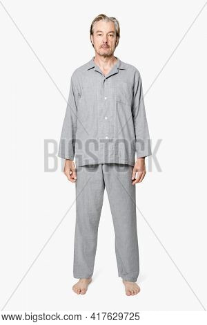 Senior man in gray pajamas nightwear apparel full body