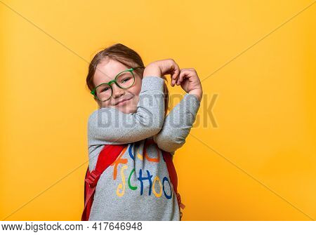 Happy Smiling Kid Girl Making Heart Sign. Advertising Gesture, Charity, Donation, Like And Education