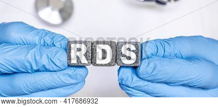 Rds Respiratory Distress Syndrome - Word From Stone Blocks With Letters Holding By A Doctor's Hands