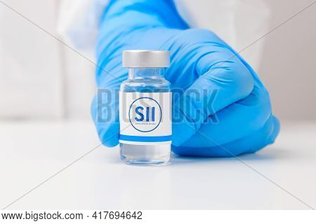 Sii Vial Or Bottle With Pharmaceuticals Demonstrated By Health Worker Or Scientist In Rubber Gloves,