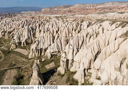 Travel In Cappadocia, Aerial View Of Cappadocia Valley With Amazing Mountain And Caves. Turkey