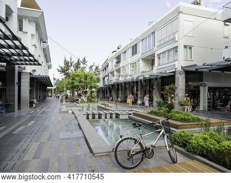 Kemer, Turkey - May 13, 2018. Tourists Walk Down Munir Ozkul Liman Street. Street With Modern Buildi