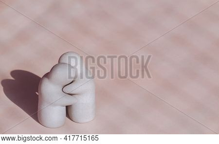 High Angle View Of Mini White Garden Ornamental Human Figurine Dolls In Hug Gesture On Pink Tile Flo