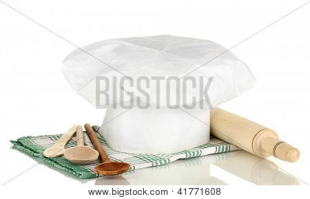 Kochmütze mit Löffel und Federballschläger, isolated on white