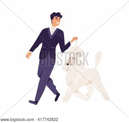 Happy Smiling Man In Elegant Formal Suit Walking With Dog. Pet Owner Leading His Royal Poodle On Lea