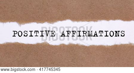 The Text Positive Affirmations Appearing Behind Torn Paper.