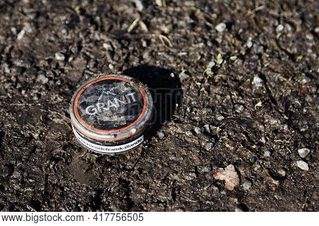 Umea, Norrland Sweden - April 7, 2021: A Snuff Box Is In Mud And Dirt. Text: - Granite, Addictive To