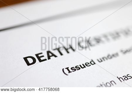 Death Certificate Is On Table. Paperwork After Death Of Relative